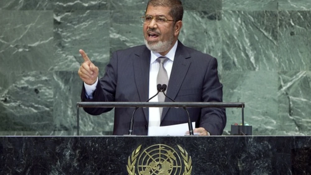 Click photo to download. Caption: Egyptian President Mohamed Morsi, seen speaking to the United Nations General Assembly, on Sept. 26, 2012, is overseeing a country with growing religious violence, particularly against Coptic Christians. Credit: UN Photo/Marco Castro.