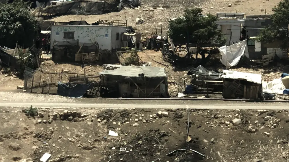 Bedouin outposts in the E1 area. Logos for the European Union can be seen on the buildings. Photo by Eliana Rudee.