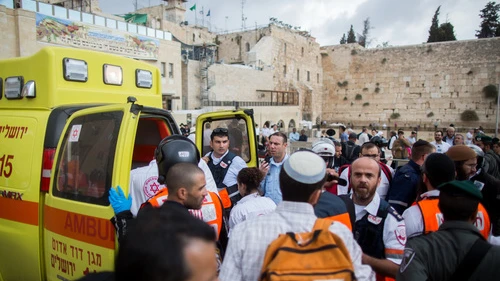 Click photo to download. Caption: Ambulances at the Western Wall evacuate injured Israelis following a terror attack in which a Palestinian woman stabbed a Jewish man near the Lions’ Gate of Jerusalem's Old City on Oct. 7, 2015. Credit: Yonatan Sindel/Flash90.