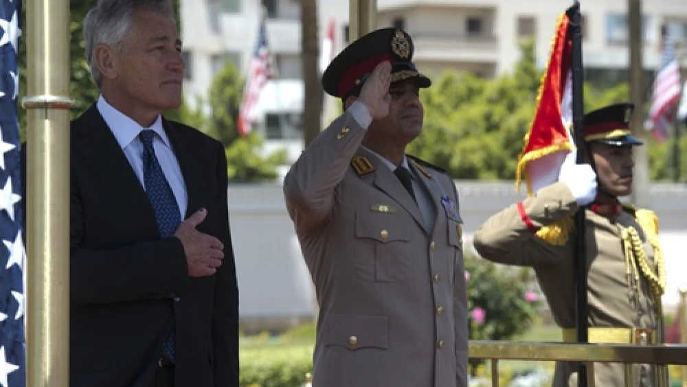 U.S. Secretary of Defense Chuck Hagel (left) participates in an arrival honors ceremony with Abdel Fattah El-Sisi (center), then the Egyptian Minister of Defense, in Cairo on April 24, 2013. Credit: Erin A. Kirk-Cuomo/Secretary of Defense via Wikimedia Commons.