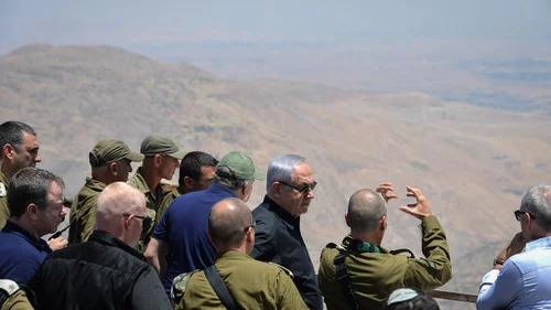 Israeli Prime Minister Benjamin Netanyahu and Security Cabinet members look into Syria from the Golan Heights, Feb. 6, 2018. Photo by Kobi Gideon/GPO.