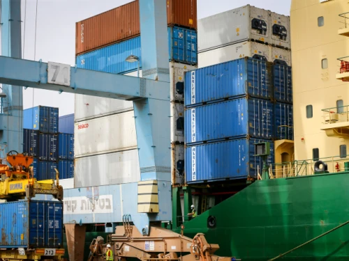 Workers unload shipping containers at Ashdod Port on Israel's southern coast on April 5, 2020. Photo by Flash90.