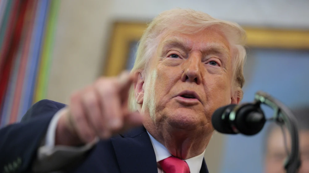U.S. President Donald Trump takes questions during a swearing-in ceremony for Secretary of Homeland Security Markwayne Mullin in the Oval Office of the White House, March 24, 2026. Photo by Chip Somodevilla/Getty Images.