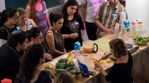Israel Girl teaching a cooking class to Israelis. Credit: Eliana Rudee