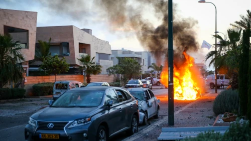 A car bursts into flames in Ashdod after being hit by a rocket fired from the Gaza Strip on May 5, 2019. Credit: Flash90.