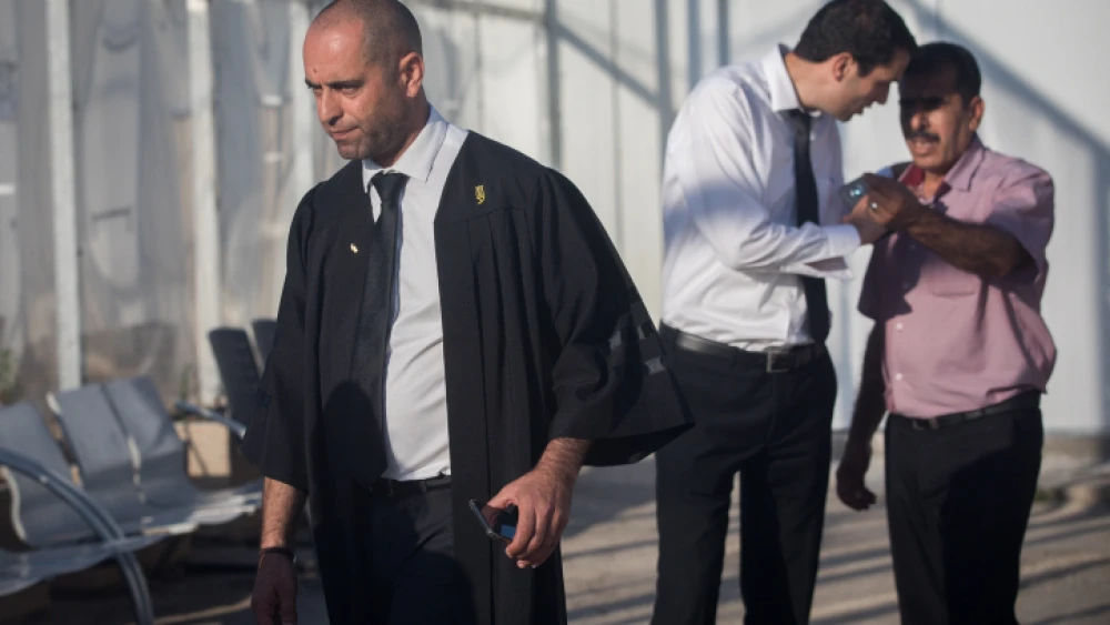 Nashef Darwish (left), the attorney for Mahmoud Katusa, a Palestinian man charged with kidnapping and raping a 7-year-old Israeli girl few months ago, stands outside Israel's Ofer military court on June 19, 2019. Photo by Yonatan Sindel/Flash90.