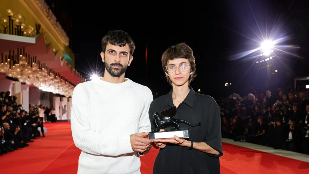 Yuval Abraham and Rachel Szor pose with the Special Jury Prize Award for "Naza" at the 83rd Venice International Film Festival on Sept. 12, 2026. Photo by Andreas Rentz/Getty Images