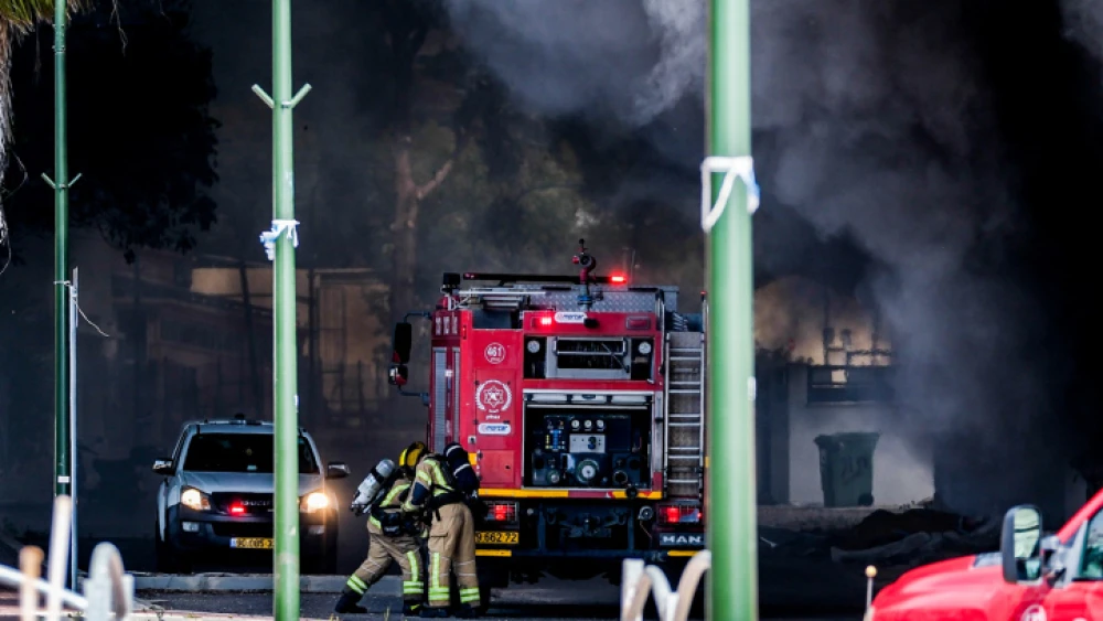 Firefighters try to extinguish a fire in the Israeli town of Shlomi caused by a rocket launched from Lebanon, April 6, 2023. Photo by Fadi Amun/Flash90.