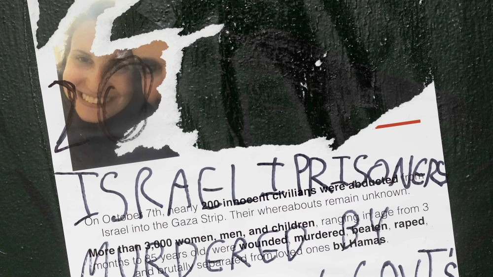 Posters distributed around New York University of people kidnapped by Hamas on Oct. 7 are vandalized and covered with pro-Palestinian graffiti on Oct. 25, 2023. Photo by Andrew Lichtenstein/Corbis via Getty Images.