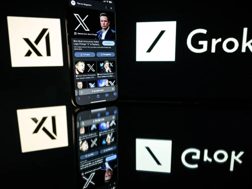 This photograph taken on Jan. 13, 2025, in Toulouse, France, shows screens displaying the logo of Grok, a generative artificial-intelligence chatbot developed by xAI, the U.S. company specializing in artificial intelligence created by Elon Musk. Photo by Lionel Bonaventure/AFP via Getty Images.