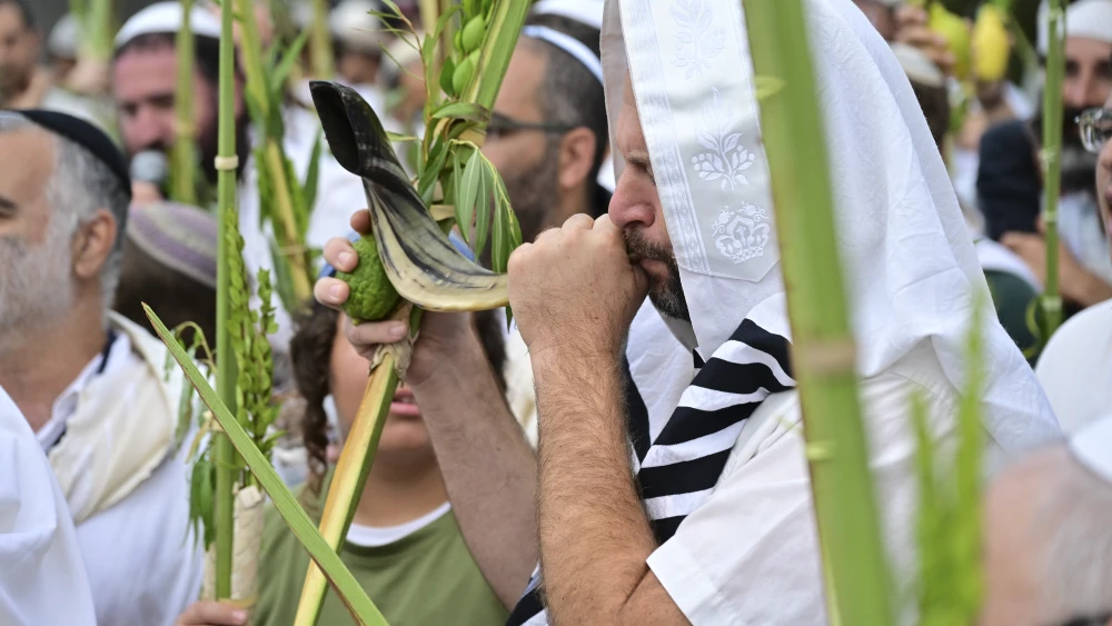 Rabbi Shmuel Eliyahu and his students hold the Four Species as they attend a morning prayer during the Jewish holiday of Sukkot, in Katzrin, northern Israel, on Oct. 12, 2025. Photo by Michael Giladi/Flash90.