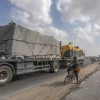 Trucks loaded with International humanitarian aid enter Gaza through the Israeli Kerem Shalom Crossing, in the southern Gaza Strip, on July 1, 2024. Photo by Abed Rahim Khatib/Flash90.