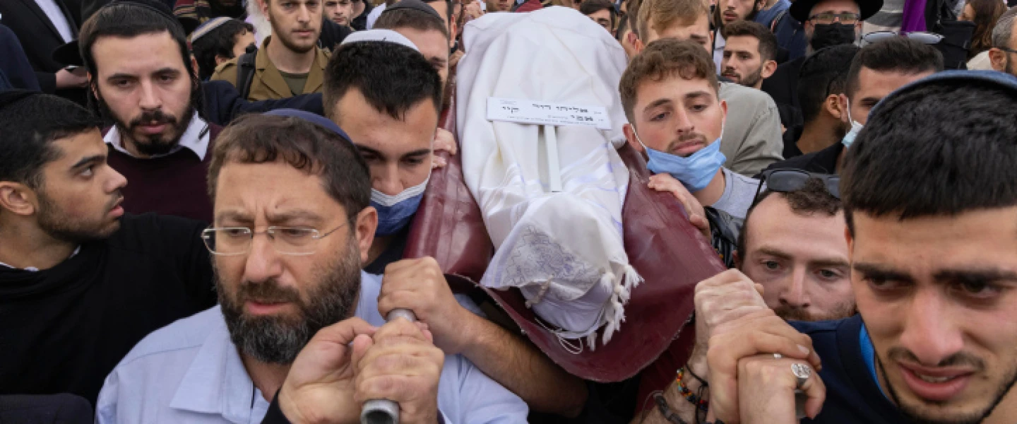 Friends and family attend the funeral of Eliyahu Kay, a 25-year-old immigrant from South Africa who was killed in a terror attack in Jerusalem's Old City, at Har HaMenuchot Cemetery in Jerusalem on Nov. 22, 2021. Photo by Olivier Fitoussi/Flash90.