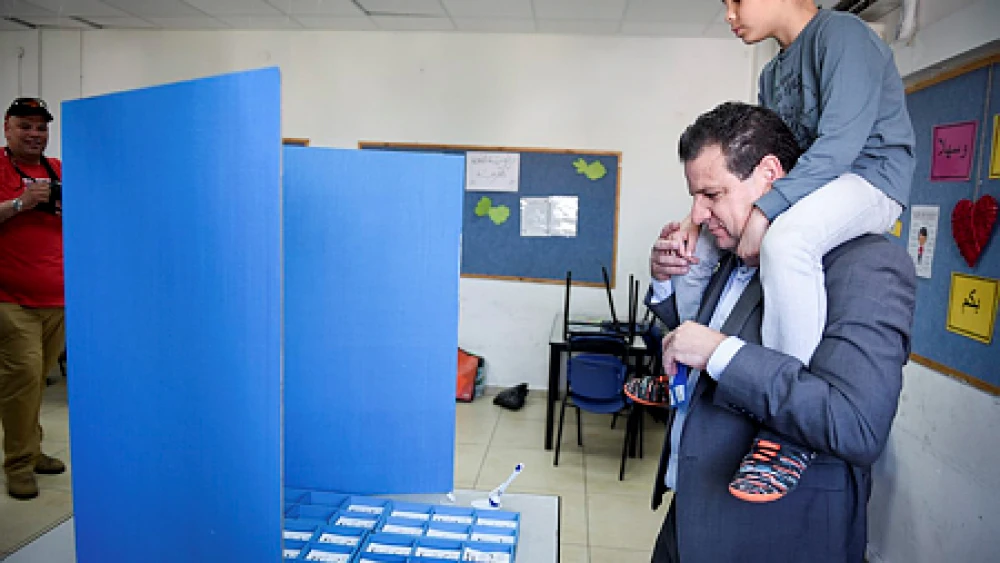 Israeli-Arab Knesset member Ayman Odeh casts his ballot at a voting station in Haifa on election day, April 9, 2019. Credit: Meir Vaknin/Flash90.