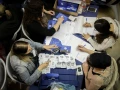 The ballots of soldiers and absentee voters are counted the day after national elections, on April 10, 2019. Photo by Noam Revkin Fenton/Flash90.