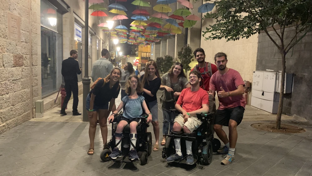 Naomi Hess (at left) surrounded by friends on her Birthright Israel trip on Jerusalem’s Ben-Yehuda Street. Credit: Courtesy.