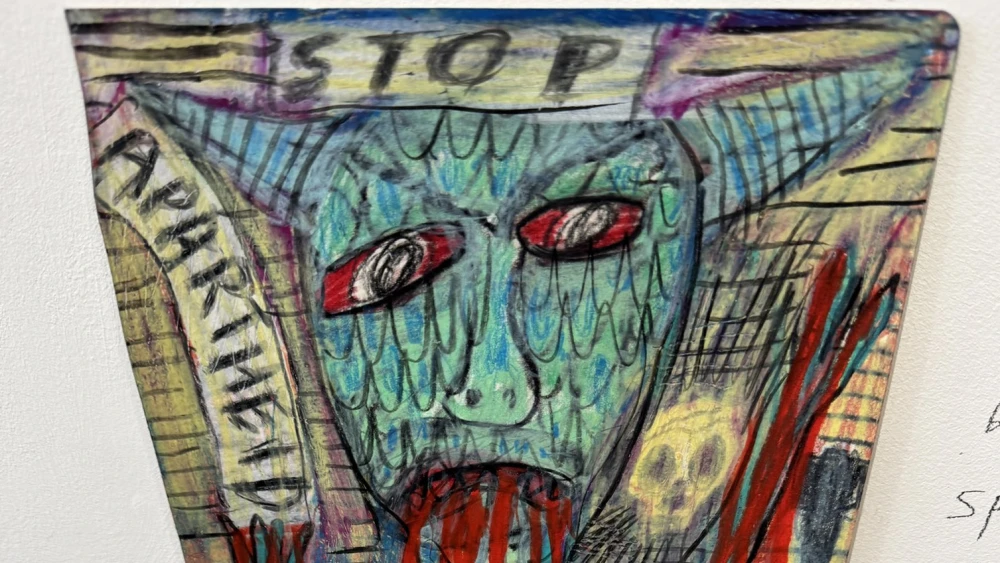 A photo of an artwork by Matthew Collings depicting Israel or Jews as a demon with blood dripping between its teeth hangs at a private gallery in Margate, the U.K. Photo courtesy of Zoe Strimpel.