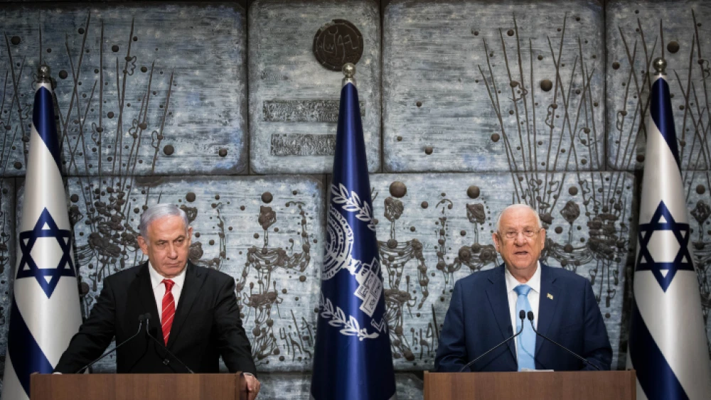 Israeli President Reuven Rivlin presents Prime Minister Benjamin Netanyahu with the mandate to form a new government after the results of the country's general election were announced, at the President's Residence in Jerusalem on Sept. 25, 2019. Photo by Yonatan Sindel/Flash90.