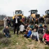 Civil administration representatives and Israelii Border Police arrive with tractors to begin preparations for evacuation and demolition of the illegal Jewish neighborhood of Netiv Ha’avot, as Jewish settlers block their way, Feb. 6, 2018. Photo by Gershon Elinson/Flash90.