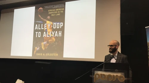 Author David Goldstein speaks about his book at a Nefesh B'Nefesh event in Jerusalem. Credit: Eliana Rudee.