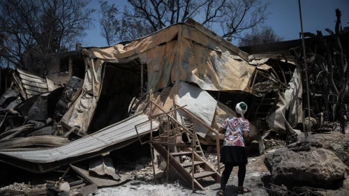 Residents check what is left of their homes after wildfires wiped out most of the houses last week in Mevo Modi’im, near the Ben Shemen Forest, on May 26, 2019. Credit: Hadas Parush/Flash90.