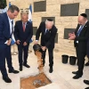 Israeli Prime Minister Benjamin Netanyahu helps out at a cornerstone-laying ceremony for a memorial hall on Mount Herzl in Jerusalem on April 19, 2023. Photo by Haim Zach/GPO.