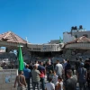 Palestinians stand near the ruins of the house of accused terrorist Muntasir Shalabi in the village of Turmus Aya, northeast of Ramallah, after it was demolished by the Israeli army, July 8, 2021. Photo by Flash90.