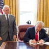 U.S. President Donald Trump, joined by Vice President Mike Pence, signs an executive order on March 19, 2018. Credit: Official White House Photo by Joyce N. Boghosian.