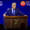 Prime Minister and Yesh Atid chairman Yair Lapid speaks to party members during a Yesh Atid party conference in Tel Aviv, August 3, 2022. Photo by Avshalom Sassoni/Flash90
