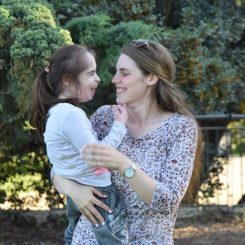 An ALEH volunteer spends time with a child with disabilities. Credit: ALEH: Advancement and Rehabilitation of Children with Complex Disabilities.