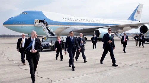 Click photo to download. Caption: President Barack Obama, surrounded by Secret Service personnel, arrives at Port Columbus International Airport in Columbus, Ohio, on March 6, 2009. Credit: Pete Souza/White House.