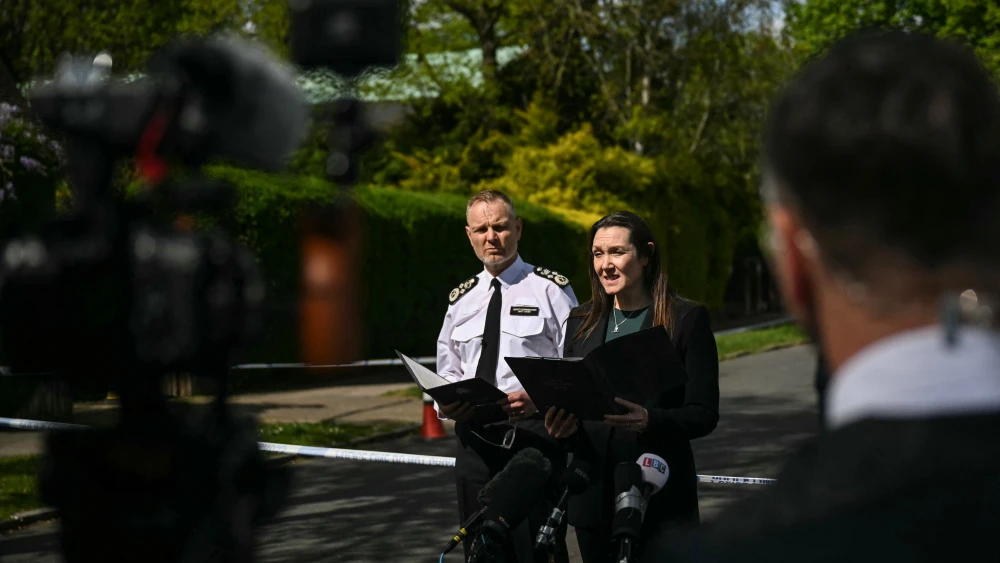 London's Metropolitan Police deputy commissioner Matt Jukes (L) looks on as deputy assistant commissioner Vicki Evans (C) makes a statement to the media