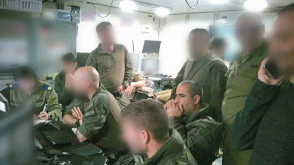Former OC 162nd Division, Maj. Gen. Itzik Cohen, and the former commander of the Shayetet 13 naval commando unit, Col A., look on from the Command Center overseeing the operation to recover Staff Sgt. Oron Shaul’s body. Credit: IDF.