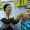 A boy is vaccinated against polio in the Neve Yaakov neighborhood of Jerusalem, Sept. 10, 2013. Photo by Yonatan Sindel/Flash90.