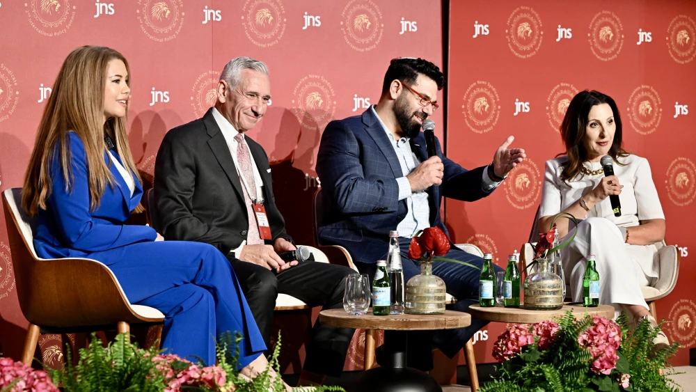 (From left) Syrian-American broadcast journalist Hayvi Bouzo; Marcus Sheff, the CEO of IMPACT-se, Dan Feferman, chairman of Sharaka, and JNS TV's Fleur Hassan-Nahoum at a panel moderated by JNS TV's Fleur Hassan-Nahoum at the JNS International Policy Summit in Jerusalem, June 23, 2026. Credit: JNS.