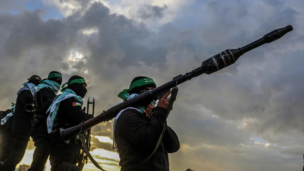 Members of Hamas’s Al-Qassam Brigades waiting for the handover of the bodies of four Israeli hostages to the Red Cross in Khan Yunis, the southern Gaza Strip, on Feb. 20, 2025. Photo by Abed Rahim Khatib/Flash90.