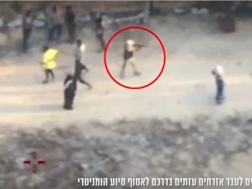 A screen capture from a video released Sunday, reportedly showing a Gazan gunman firing at civilians in Khan Yunis on June 1, 2025. Screenshot: IDF Spokesperson's Unit.