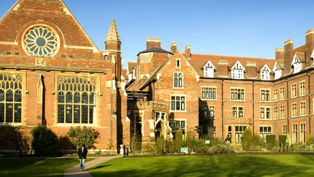 A student walks outside Homerton College in Cambridge, U.K. Photo credit: The University of Cambridge.