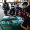 Hamas terrorists register Palestinian children for “Saif Al-Quds” camps in Rafah, in the southern Gaza Strip, on June 14, 2021. Photo by Abed Rahim Khatib/Flash90.