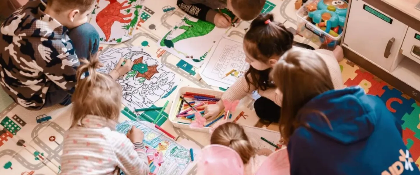Ukrainian refugee children enjoying activities in an IsraAID community center. Source: Screenshot