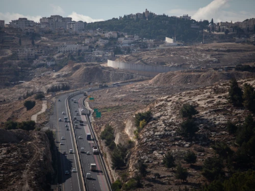 The Ma'ale Adumim-Jerusalem road, from the Judean Desert area known as E1, with Jerusalem's Mount Scopus seen on the horizon, Dec. 10, 2019. Photo by Hadas Parush/Flash90.
