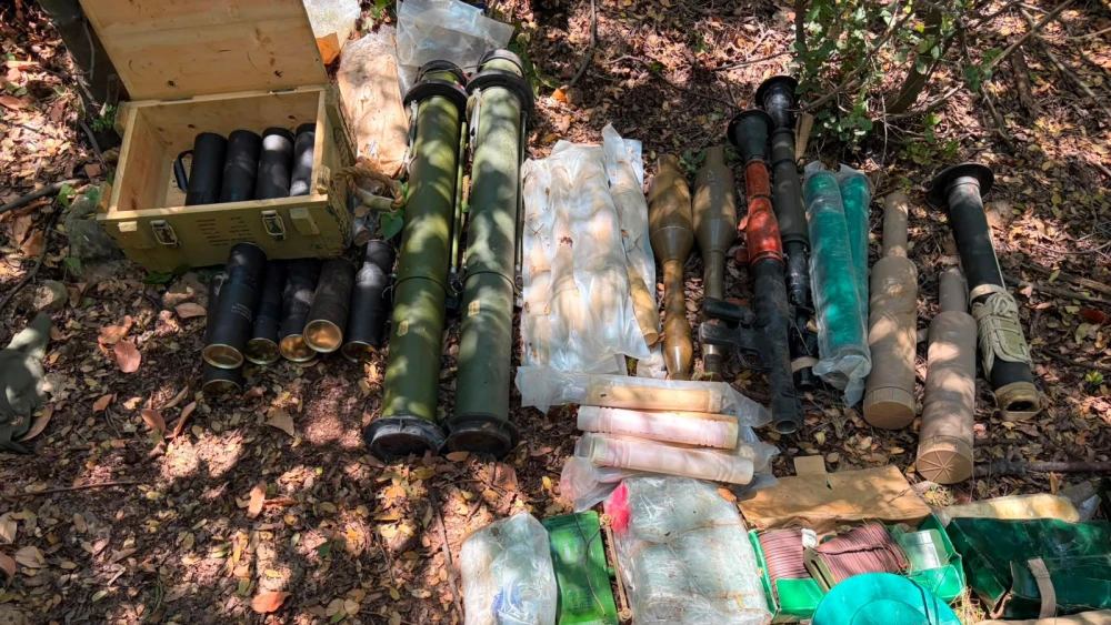 Hezbollah weapons, including anti-tank launchers, mortar rounds, explosives and ammunition, recovered by Israel Defense Forces soldiers during an operation in the village of Majdal Zoun in Southern Lebanon, July 2026. Credit: IDF Spokesperson's Unit.