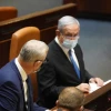Israeli Prime Minister Benjamin Netanyahu (right) and Defense Minister Benny Gantz vote for the budget deadline extension bill on Aug. 24, 2020. Credit: Yehonatan Samiyeh/Knesset Spokesperson's Office.