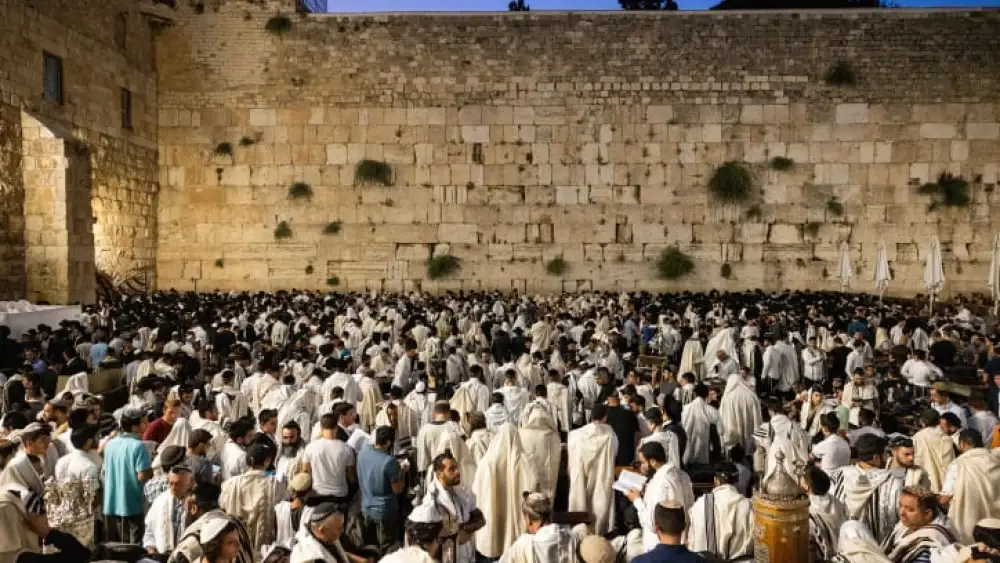 Jewish men pray during Tisha B'Av, at the Wall Western, in the Old City of Jerusalem, on July 27, 2023. The Tisha B'Av ceremony, literally the ninth day of the month of Av in the Hebraic calendar, is the darkest day in the Jewish calendar, marking the destruction of the two temples, first by the Babylonians in 587 BC and later by the Romans in 70 AD. Photo by Chaim Goldberg/Flash90 *** Local Caption *** ????? ???? ???? ??? ?????? ????? ??? ?? ????? ?????