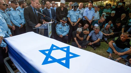 Israel’s Public Security Minister Gilad Erdan speaks at the funeral of Druze police officer Kamil Shnaan in the northern village of Hurfeish, July 14, 2017. Shnaan was one of two Druze police officers killed by Arab terrorists last Friday near the Temple Mount in Jerusalem. Credit: Basel Awidat/Flash90.