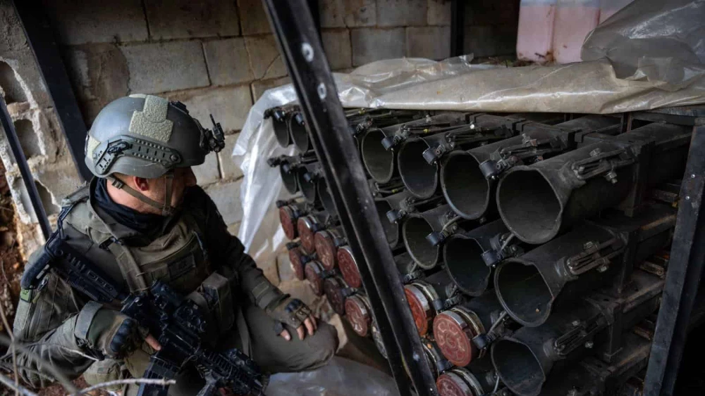 An Israeli soldier examines anti-tank ordnance seized from Hezbollah's Radwan Force in Southern Lebanon, Dec. 28, 2024. Credit: IDF.