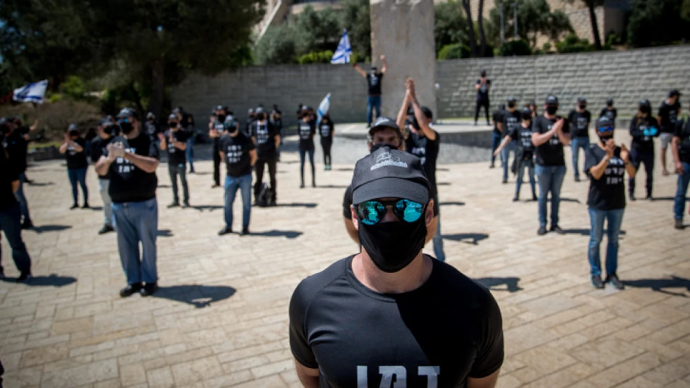 Israelis dressed in black against government corruption and for democracy stand outside the Israeli Supreme Court in Jerusalem on April 30, 2020. Photo by Yonatan Sindel/Flash90.