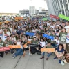 A group of soon-to-be volunteers in the Israel Defense Forces gather outside of John F. Kennedy Airport in New York and salute their future. Credit: Shahar Azram.