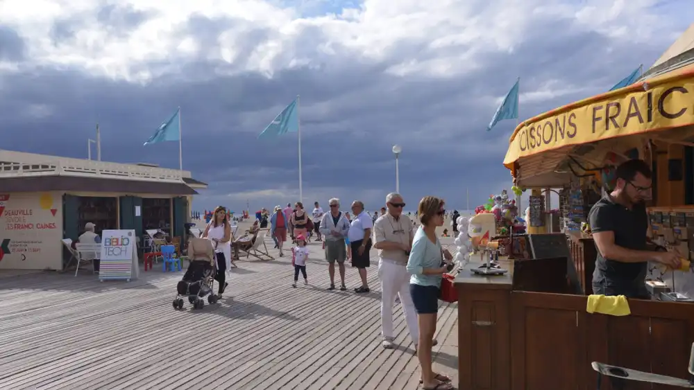 Beach goers walk around the entrance to the main boardwalk of Deauville, France, on July 24, 2015. (Canaan Lidor)