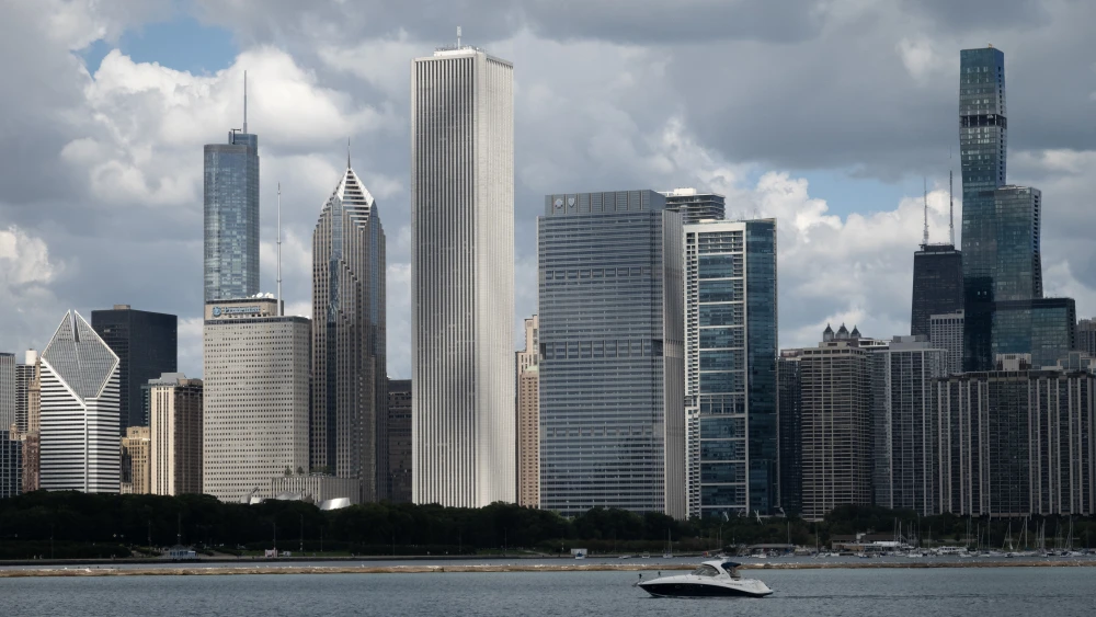A boat cruises across the skyline on Aug. 26, 2025 in Chicago, Illinois. Photo by Scott Olson/Getty Images.